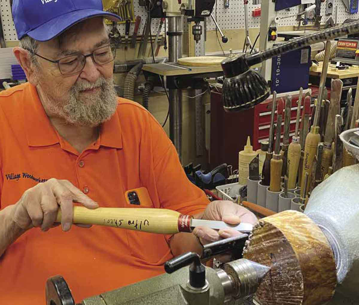Senior man working on a lathe