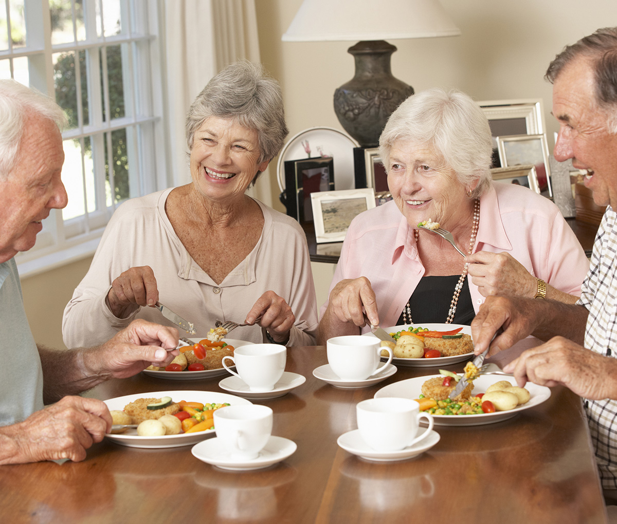 Image of seniors around a table