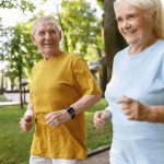 Senior man and woman jogging together