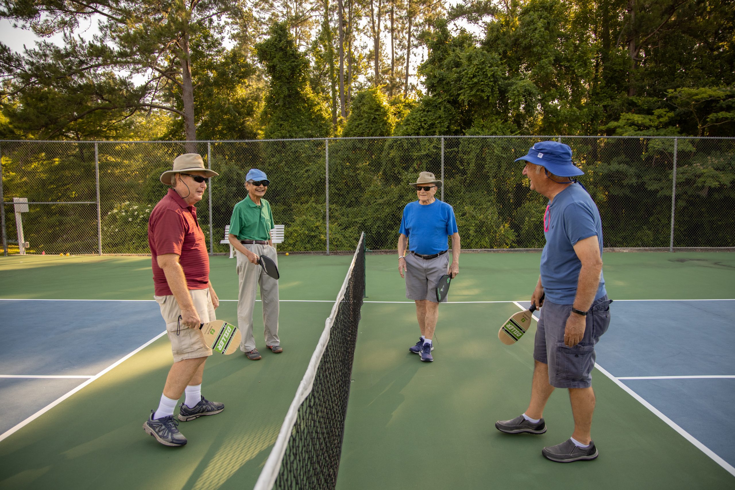 group of seniors playing pickleball